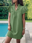 Mini-robe crantée à volants et manches volantées