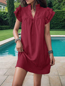 Mini-robe crantée à volants et manches volantées