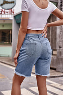Short en denim à ourlet brut avec poches