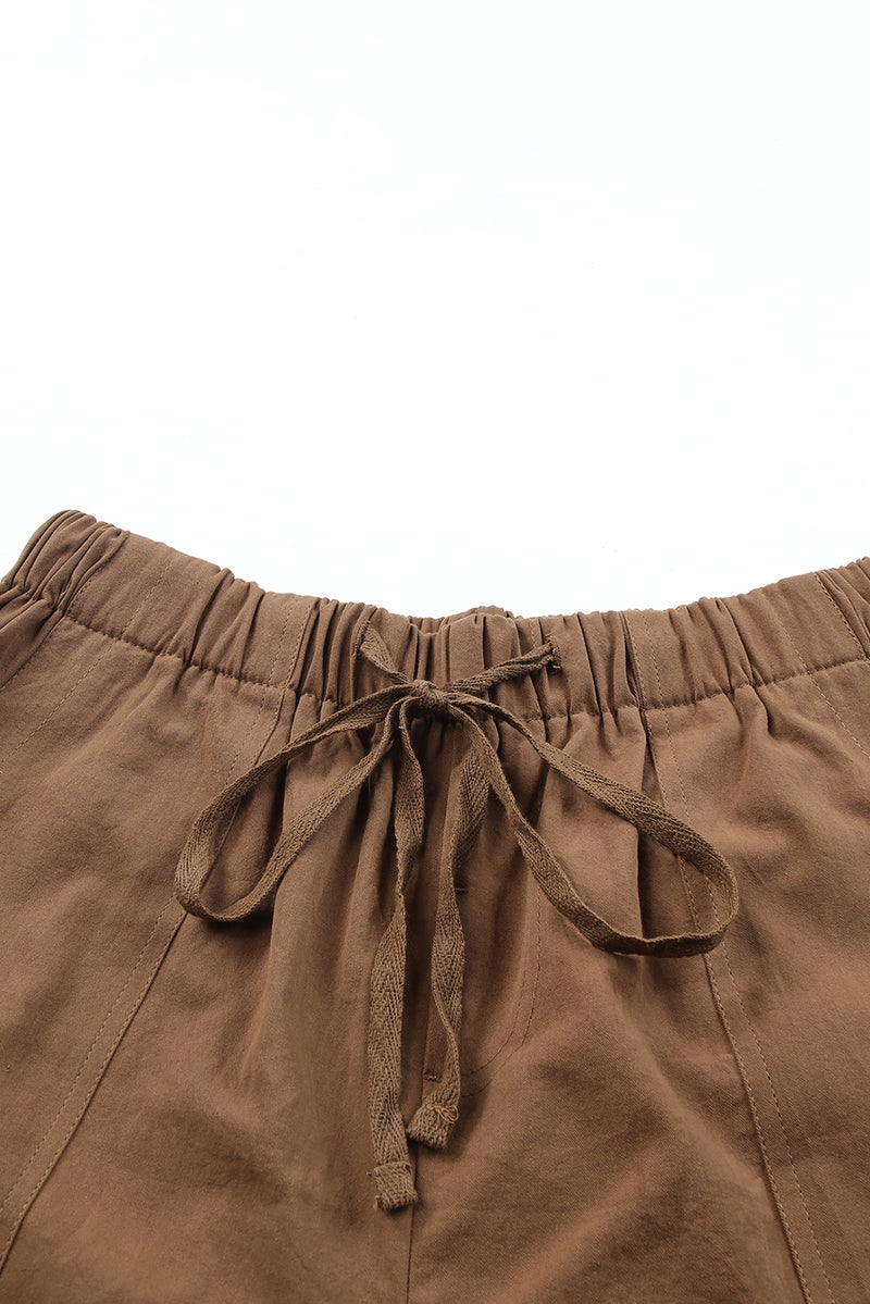 Shorts con bolsillo y cintura elástica con cordón