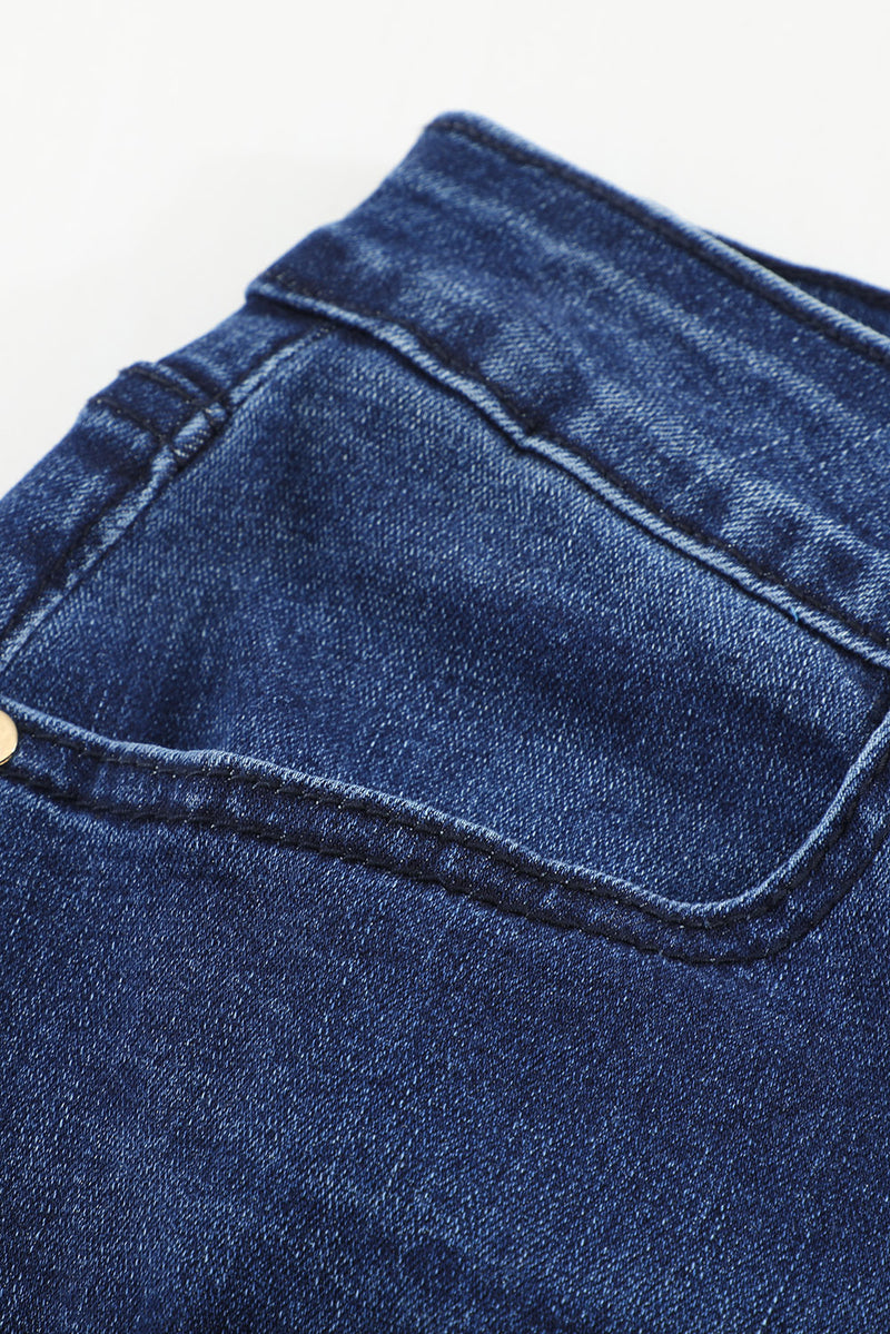 Jeans ajustados desgastados de cintura media