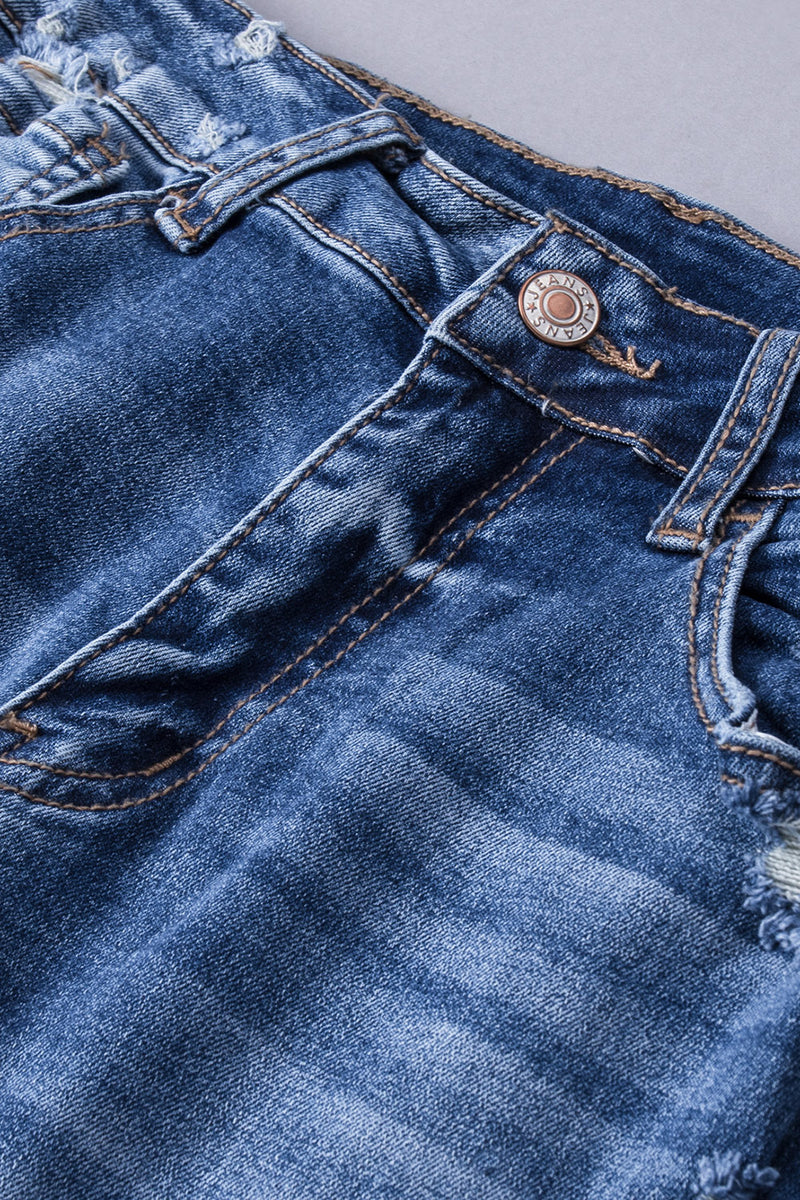 Jeans acampanados desgastados con bolsillos