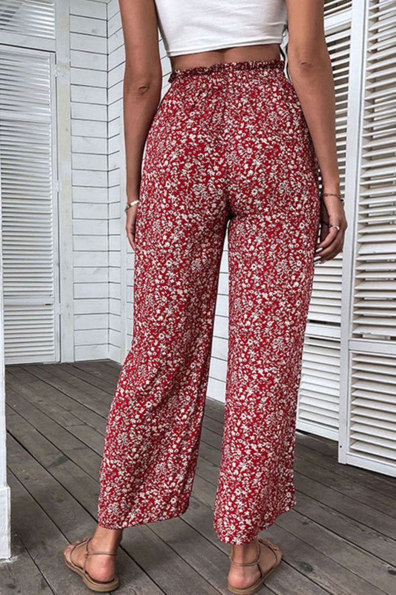 Pantalones de pernera ancha con cintura paperbag y abertura floral ditsy