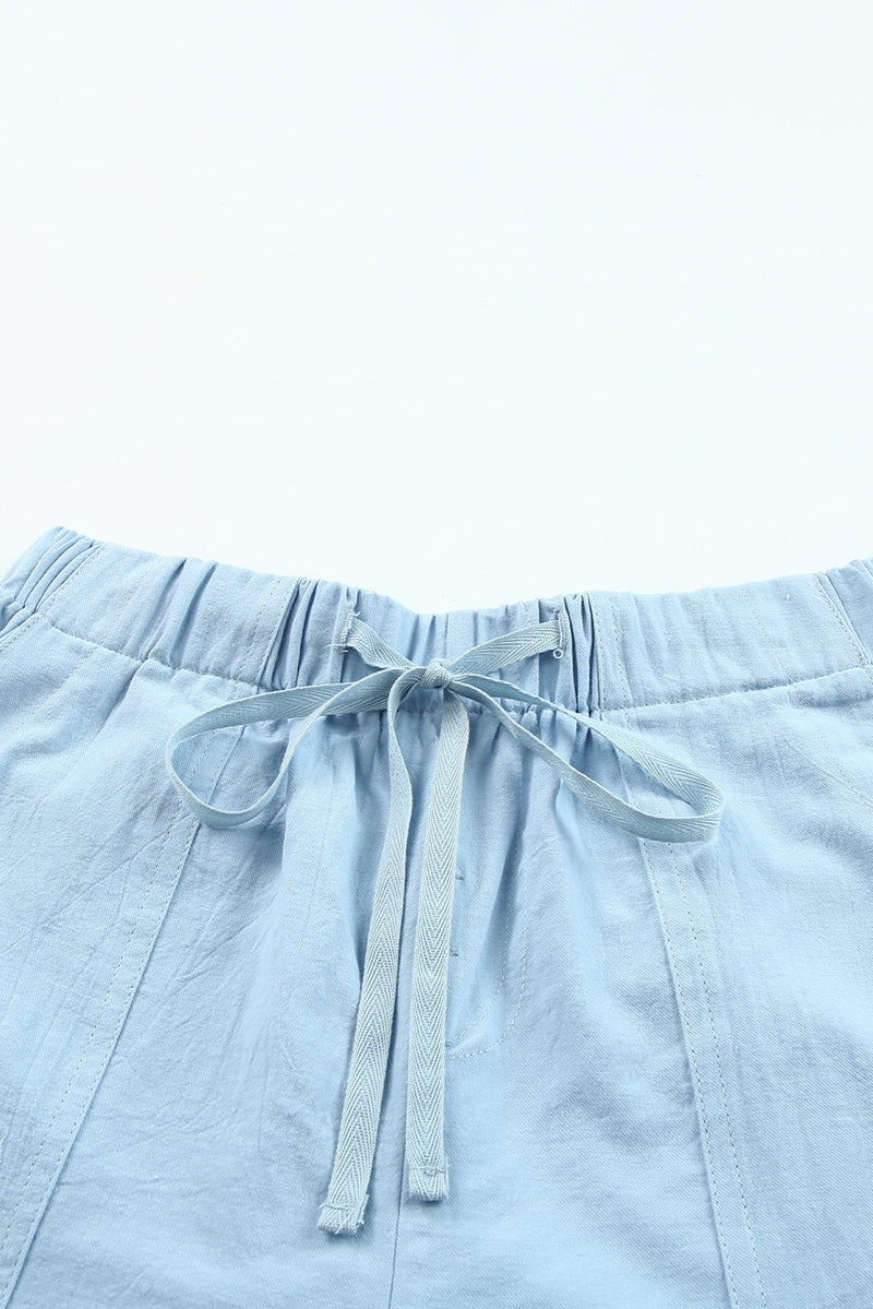 Shorts con bolsillo y cintura elástica con cordón