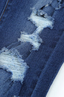 Vaqueros pitillo desgastados de cintura alta